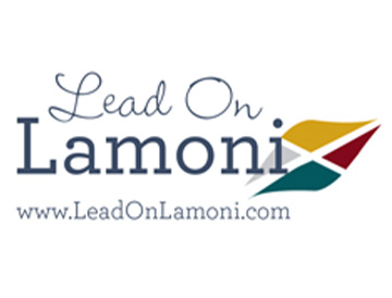 Logo with the words "Lead On Lamoni" in blue text, featuring a stylized leaf with gold, green, red, and gray sections, and the website "www.LeadOnLamoni.com" below.